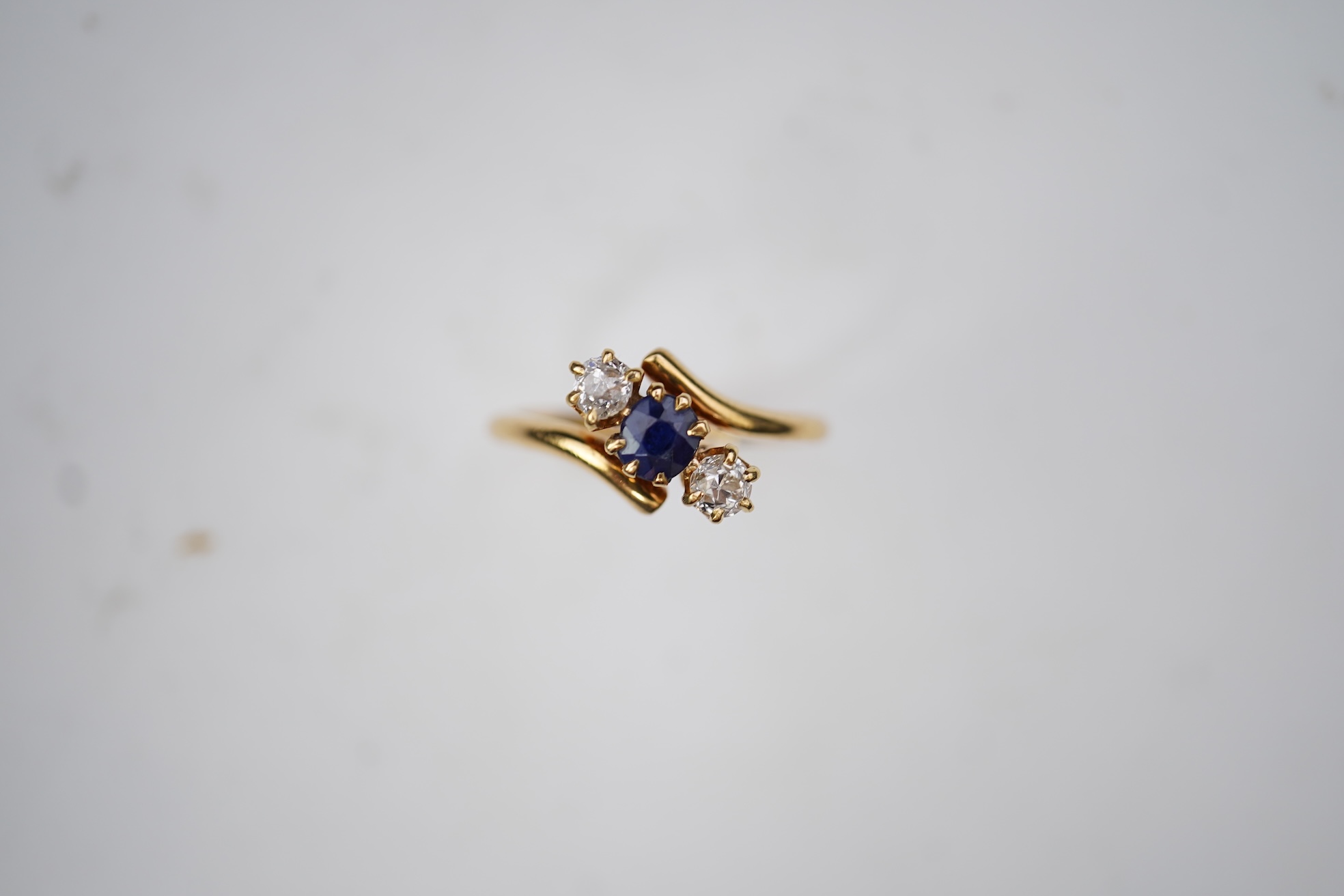 A sapphire and diamond three-stone ring, early 20th century